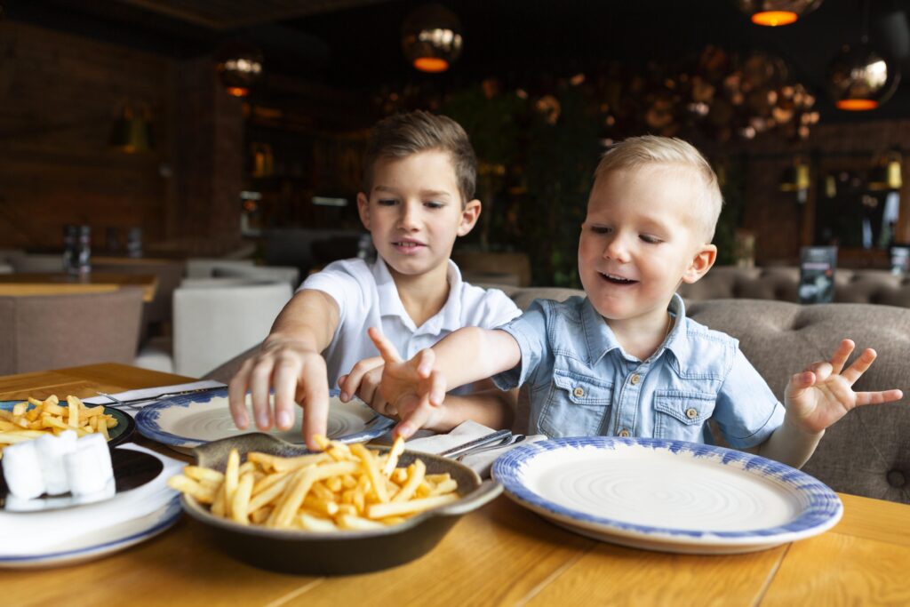 kids eating fries on a la hotels